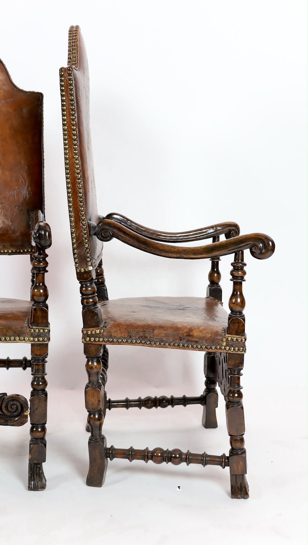 A pair of late 17th century Spanish walnut and elm armchairs, width 69cm, depth 61cm, height 141cm